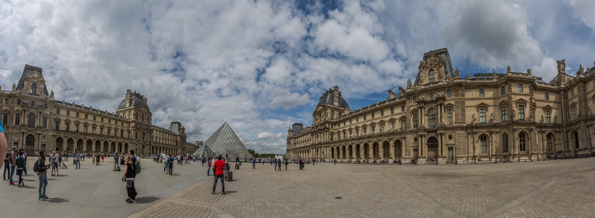 The Louvre and its glass pyramid in Paris, France